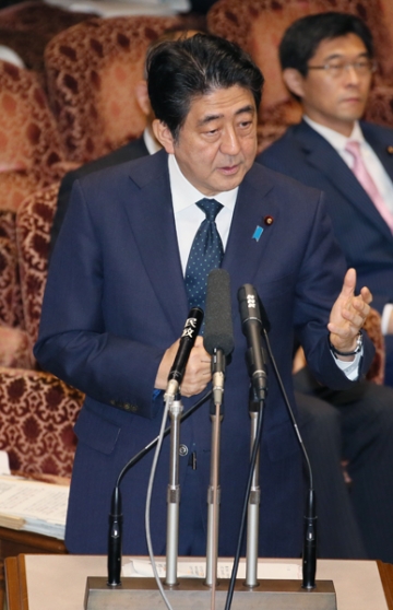 Prime Minister Abe at a meeting of the House of Councillors Special Committee on the Legislation for Peace and Security of Japan and the International Community. © Official Website of the Prime Minister of Japan and His Cabinet (http://japan.kantei.go.jp/97_abe/actions/201509/14article1.html)